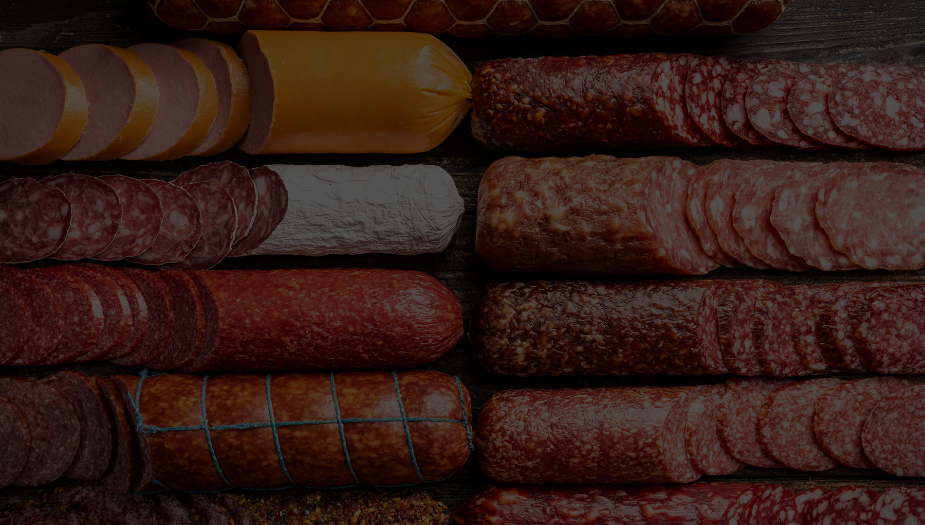 An assortment of artisanal cured meats and sausages.