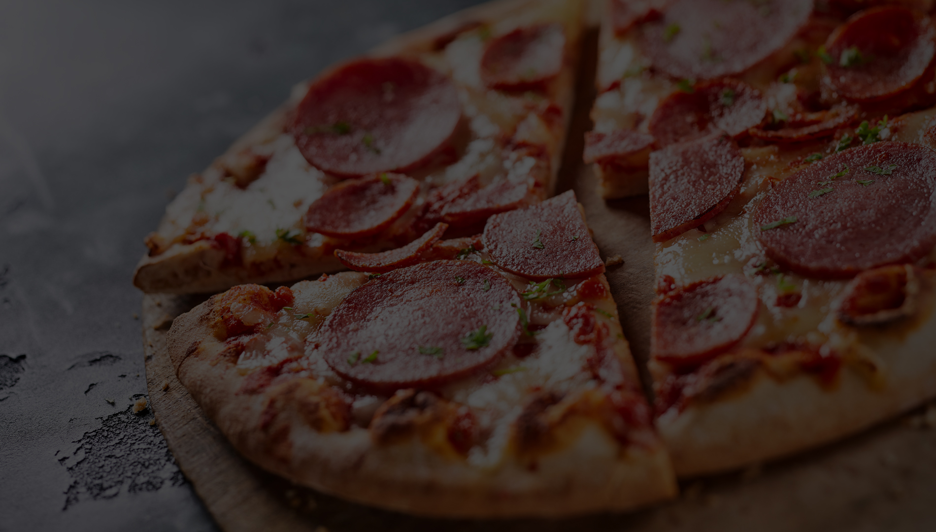 A close-up of a delicious pepperoni pizza with fresh toppings.
